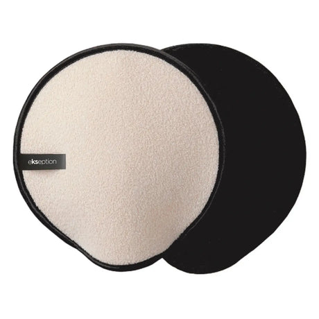 Beige och svart handske med textur, stående på ljus bakgrund – en peelinghandske som tar bort döda hudceller och förbereder huden för självbruning.