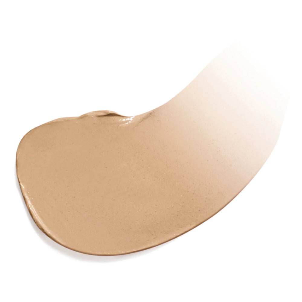 Färgad fuktighetskräm i nyansen Medium Dark, vit bakgrund.