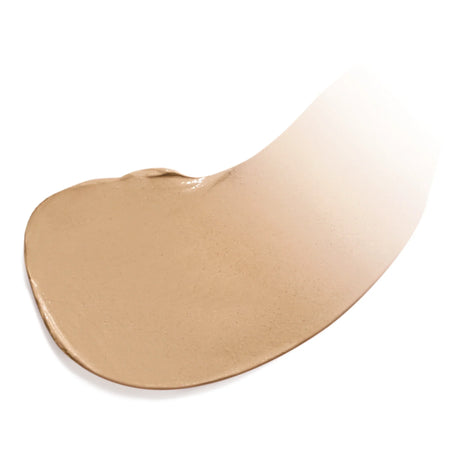 Färgad fuktighetskräm i nyansen Medium Dark, vit bakgrund.