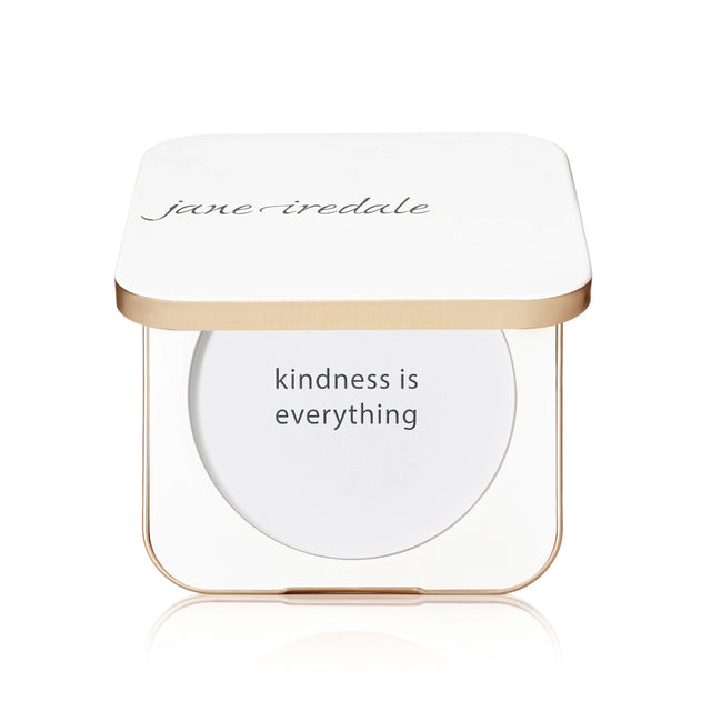 Visar ett återanvändbart fodral i ljus plast med rund form. Insidan har en spegel för enkel användning.