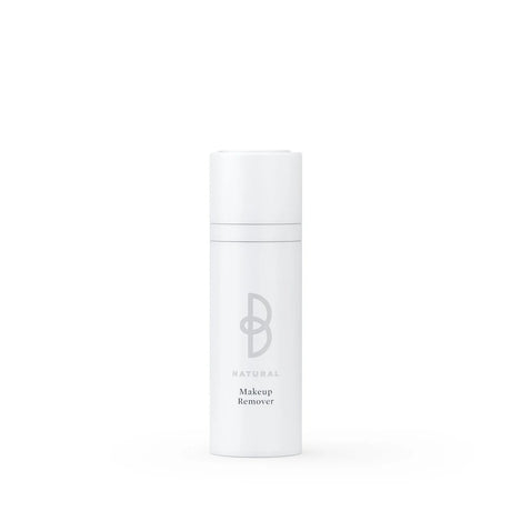 Vit flaska med svart text, stående på ljus bakgrund – en makeup-remover som tar bort smink snabbt och effektivt.