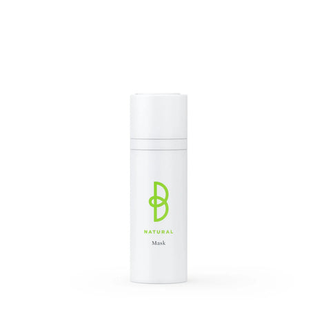 Vit flaska med svart text, stående på ljus bakgrund – en mask som minskar rynkor, ger näring och lyster.