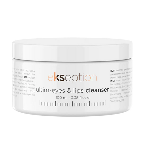 Vit burk med svart text, stående på ljus bakgrund – en rengöring som tar bort alla typer av smink och vårdar ögon- och läppområdet.