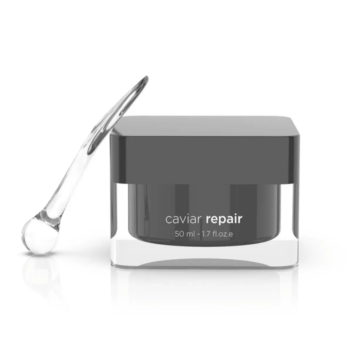 Svart burk med svart text och rund form, stående på ljus bakgrund – ansiktskräm