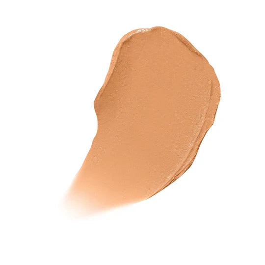 Närbild av en ljus nyans av concealer i swatchform, mot vit bakgrund. Ger en visuell representation av produktens färg.